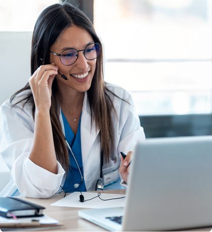 HealthTech USA team member on a support call at her laptop
